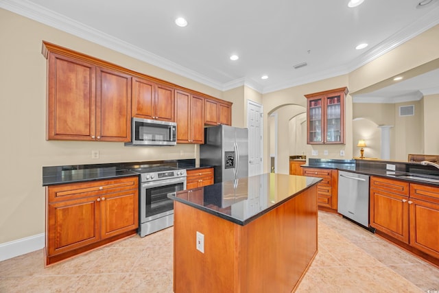 8546 San Marcello Dr Unit 1-102, Myrtle Beach, SC 29579 - kitchen with stainless steel appliances, arched walkways, recessed lighting, a center island, and a sink