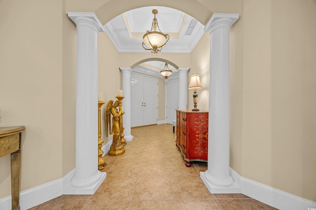 8546 San Marcello Dr Unit 1-102, Myrtle Beach, SC 29579 - foyer entrance featuring arched walkways, decorative columns, ornamental molding, a tray ceiling, and light tile patterned flooring