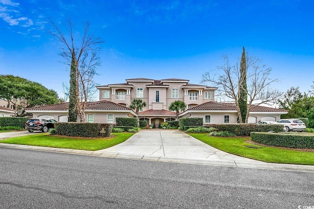 8546 San Marcello Dr Unit 1-102, Myrtle Beach, SC 29579 - mediterranean / spanish home featuring a tiled roof, stucco siding, driveway, and a front yard