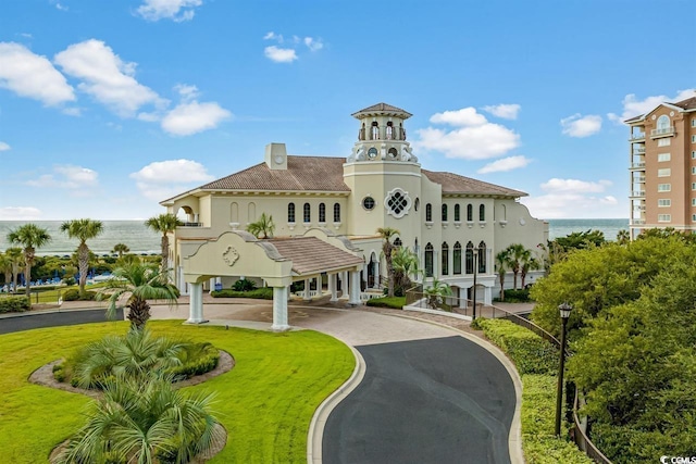 8546 San Marcello Dr Unit 1-102, Myrtle Beach, SC 29579 - view of property featuring asphalt driveway, a carport, and a water view