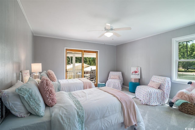 carpeted bedroom featuring crown molding, a ceiling fan, and access to exterior
