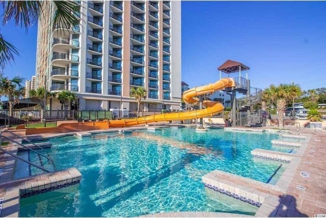 3000 Ocean Blvd N Unit 508, Myrtle Beach, SC 29577 - community pool featuring a water slide and fence