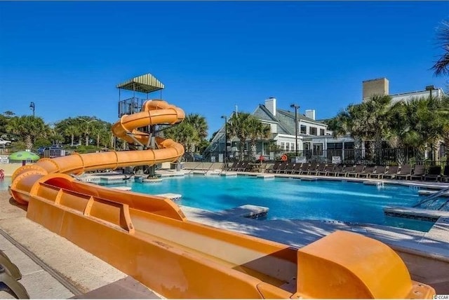 3000 Ocean Blvd N Unit 508, Myrtle Beach, SC 29577 - community pool featuring a water slide and fence