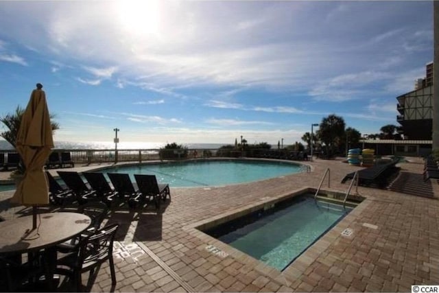 3000 Ocean Blvd N Unit 508, Myrtle Beach, SC 29577 - community pool featuring a patio