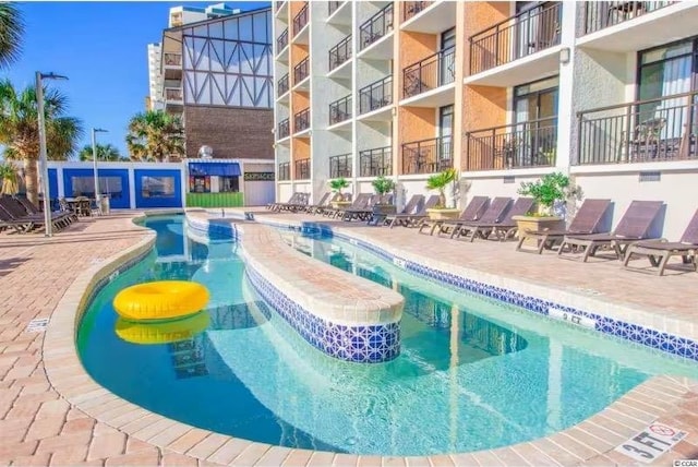 3000 Ocean Blvd N Unit 508, Myrtle Beach, SC 29577 - community pool featuring a patio area