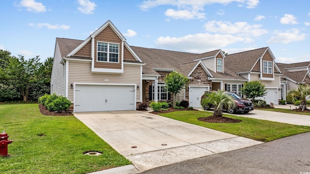 view of front of house featuring concrete driveway, a front lawn, stone siding, and an attached garage