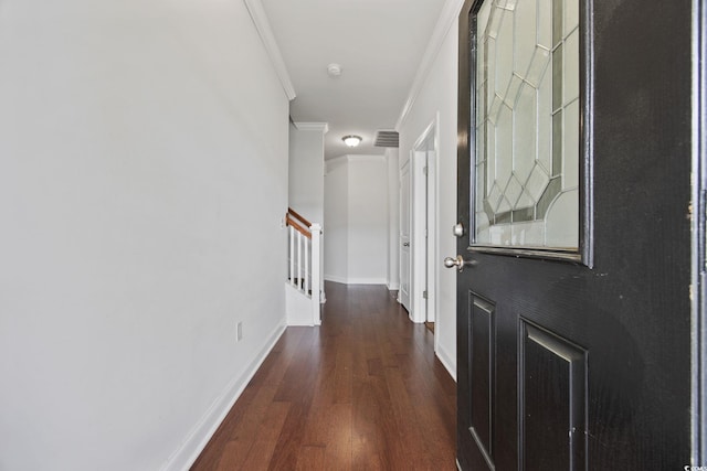 corridor with crown molding, stairs, dark wood-style flooring, and baseboards