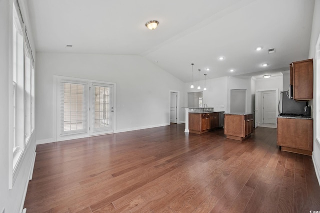 unfurnished living room with vaulted ceiling, dark wood-type flooring, a sink, baseboards, and recessed lighting