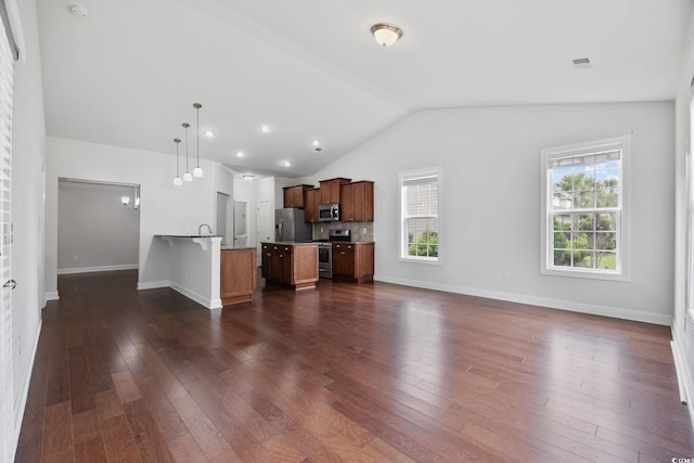 unfurnished living room with vaulted ceiling, dark wood-style flooring, and baseboards