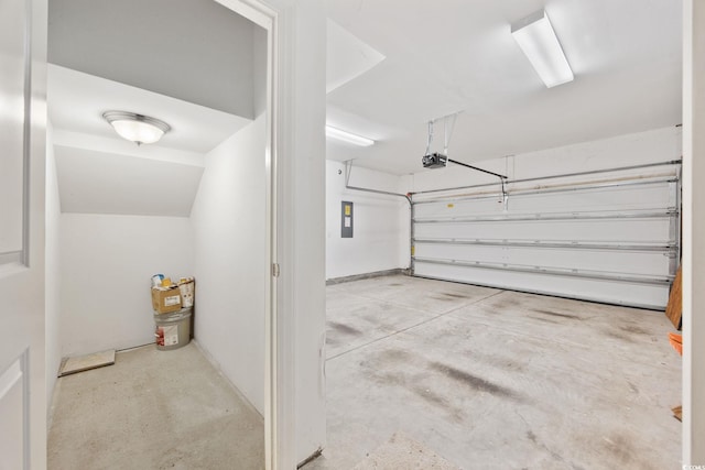 garage with a garage door opener and electric panel