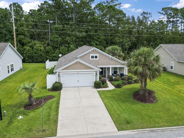 view of front of property featuring a garage and concrete driveway