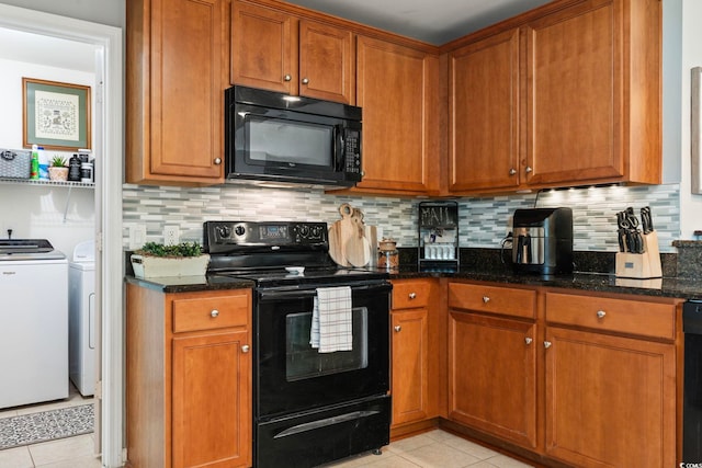 424 Enderby Way, Little River, SC 29566 - kitchen with black appliances, washer and clothes dryer, light tile patterned flooring, and dark stone countertops