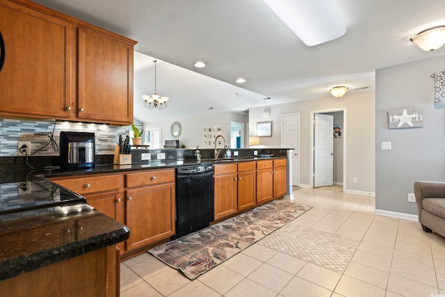 kitchen featuring dishwasher, backsplash, a peninsula, brown cabinetry, and a chandelier