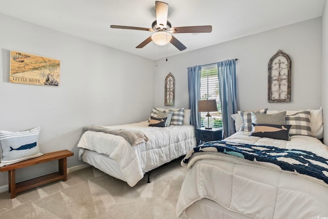 carpeted bedroom with baseboards and ceiling fan