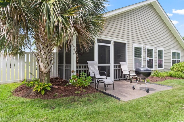 424 Enderby Way, Little River, SC 29566 - back of house with a sunroom and a patio