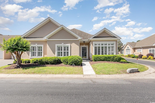 1435 Saint Thomas Cir Unit E-1, Myrtle Beach, SC 29577 - view of front of house featuring stucco siding and a front yard