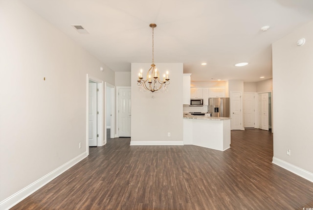 1435 Saint Thomas Cir Unit E-1, Myrtle Beach, SC 29577 - unfurnished living room with dark wood finished floors, a chandelier, baseboards, and recessed lighting