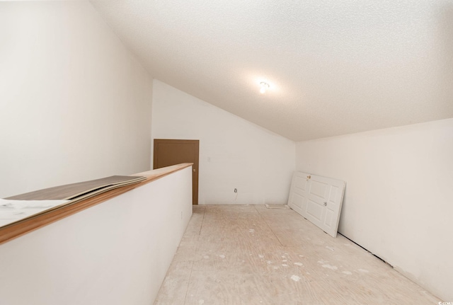 1435 Saint Thomas Cir Unit E-1, Myrtle Beach, SC 29577 - additional living space with vaulted ceiling and a textured ceiling