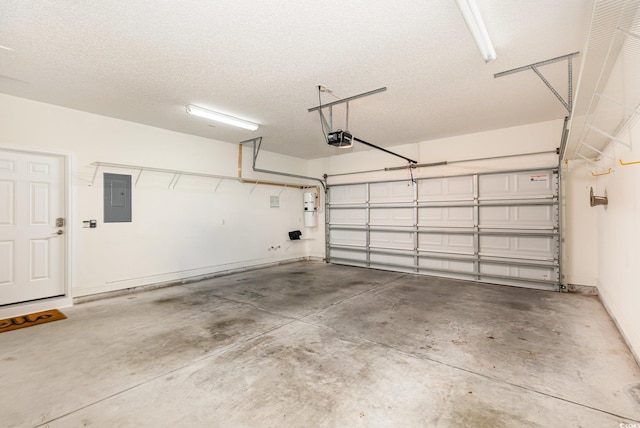 1435 Saint Thomas Cir Unit E-1, Myrtle Beach, SC 29577 - garage with a garage door opener, electric panel, and a central vacuum unit