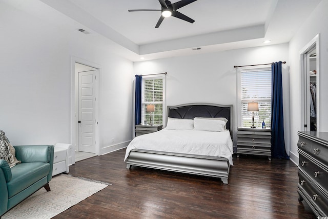 bedroom with wood finished floors, baseboards, and ceiling fan