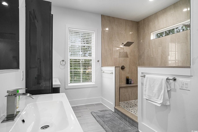full bathroom with a sink, a walk in shower, baseboards, wood finished floors, and recessed lighting