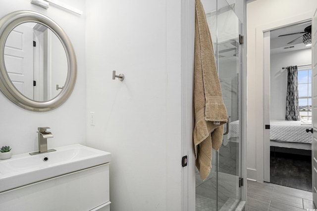 full bathroom with a shower stall, vanity, and ensuite bath
