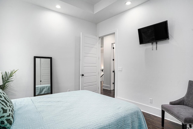bedroom featuring dark wood-style floors, recessed lighting, and baseboards