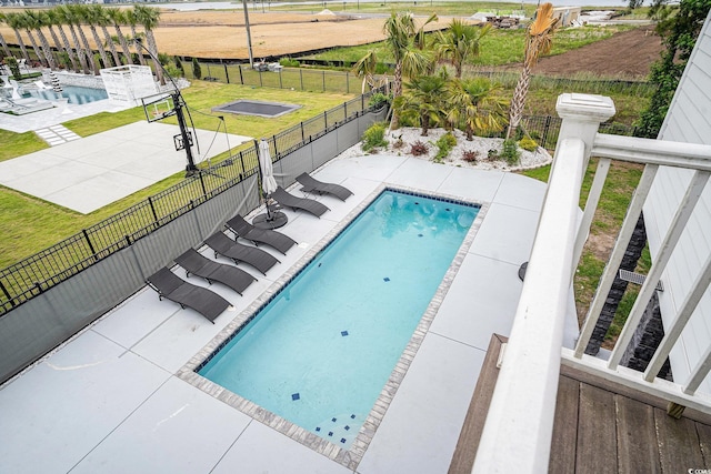 view of pool featuring a patio area