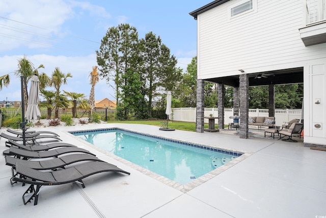 view of swimming pool with a patio area, outdoor lounge area, and a fenced backyard