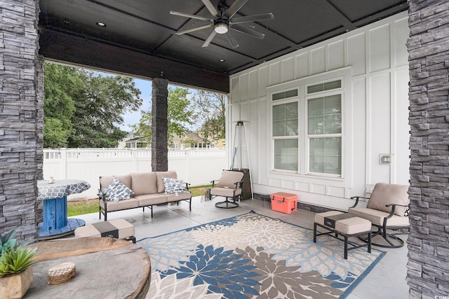 view of patio / terrace with ceiling fan, an outdoor hangout area, and fence