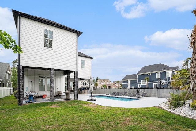 view of pool with a patio area and a residential view