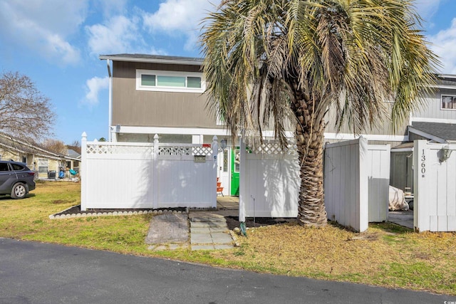 view of property exterior featuring fence