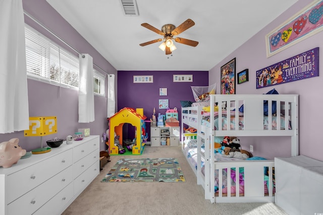 carpeted bedroom featuring ceiling fan
