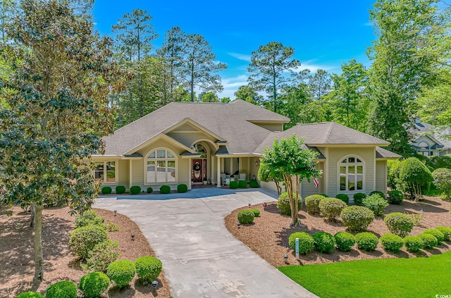 1206 Spinnaker Dr, North Myrtle Beach, SC 29582 - view of front facade with roof with shingles and curved driveway