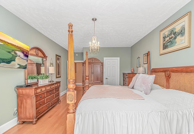 1206 Spinnaker Dr, North Myrtle Beach, SC 29582 - bedroom with light wood finished floors and a chandelier