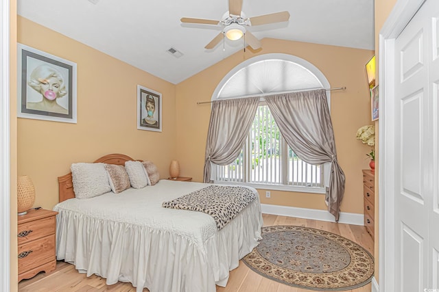 1206 Spinnaker Dr, North Myrtle Beach, SC 29582 - bedroom featuring light wood-type flooring, vaulted ceiling, and a ceiling fan