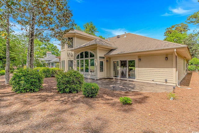 1206 Spinnaker Dr, North Myrtle Beach, SC 29582 - rear view of property with roof with shingles and a patio