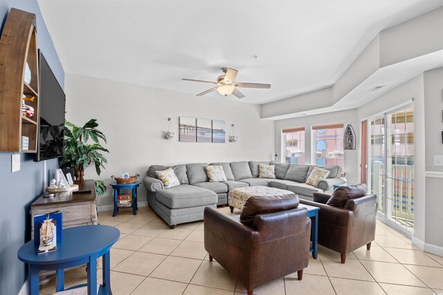 3401 N Ocean Blvd Unit 309, North Myrtle Beach, SC 29582 - living room featuring light tile patterned floors, a ceiling fan, and baseboards