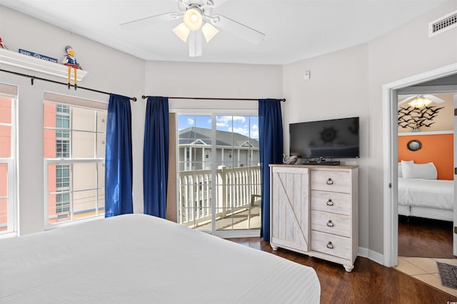 3401 N Ocean Blvd Unit 309, North Myrtle Beach, SC 29582 - bedroom with access to exterior, dark wood finished floors, a ceiling fan, and baseboards