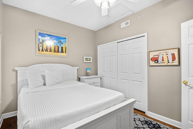 3401 N Ocean Blvd Unit 309, North Myrtle Beach, SC 29582 - bedroom featuring attic access, baseboards, a closet, dark wood-style floors, and ceiling fan