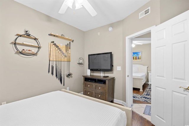 3401 N Ocean Blvd Unit 309, North Myrtle Beach, SC 29582 - bedroom featuring dark wood-type flooring, connected bathroom, and ceiling fan