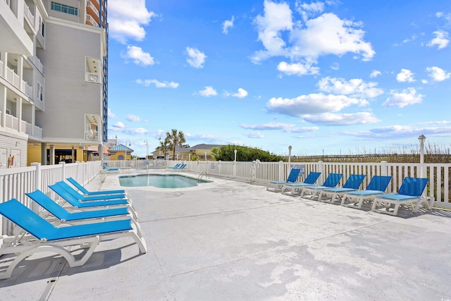 3401 N Ocean Blvd Unit 309, North Myrtle Beach, SC 29582 - community pool with a patio and fence