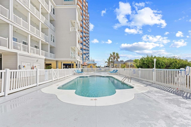 3401 N Ocean Blvd Unit 309, North Myrtle Beach, SC 29582 - community pool featuring fence and a patio