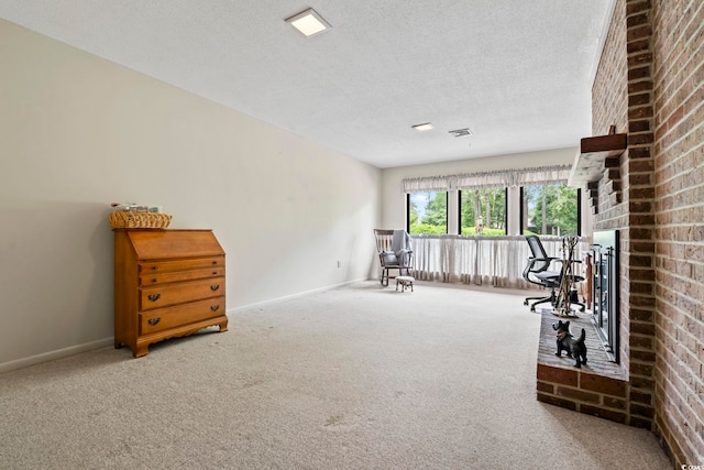 unfurnished room featuring carpet, baseboards, a brick fireplace, and a textured ceiling