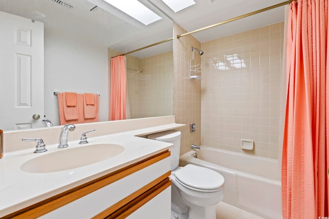 full bathroom with shower / tub combo with curtain, toilet, and vanity