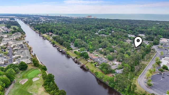 aerial view of residential area featuring a large body of water