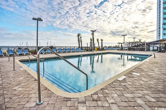 1501 S Ocean Blvd Unit 1250, Myrtle Beach, SC 29577 - community pool with fence and a patio