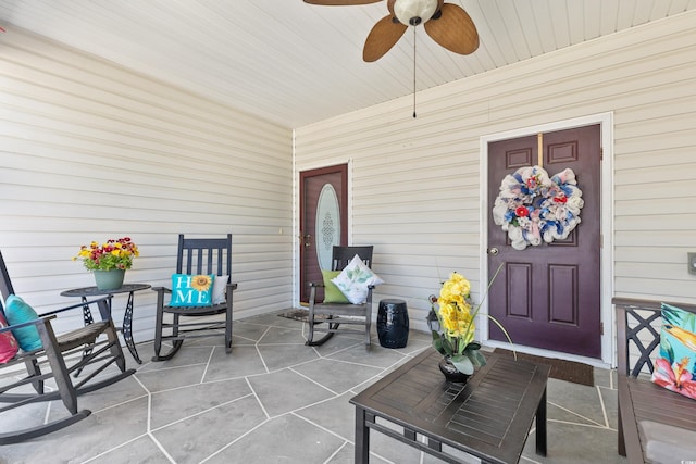 doorway to property with ceiling fan