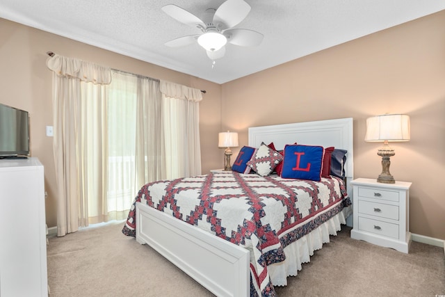 bedroom featuring light carpet, baseboards, and ceiling fan