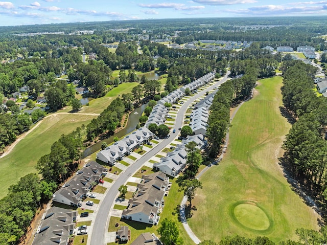 aerial view of property and surrounding area with a golf club and nearby suburban area